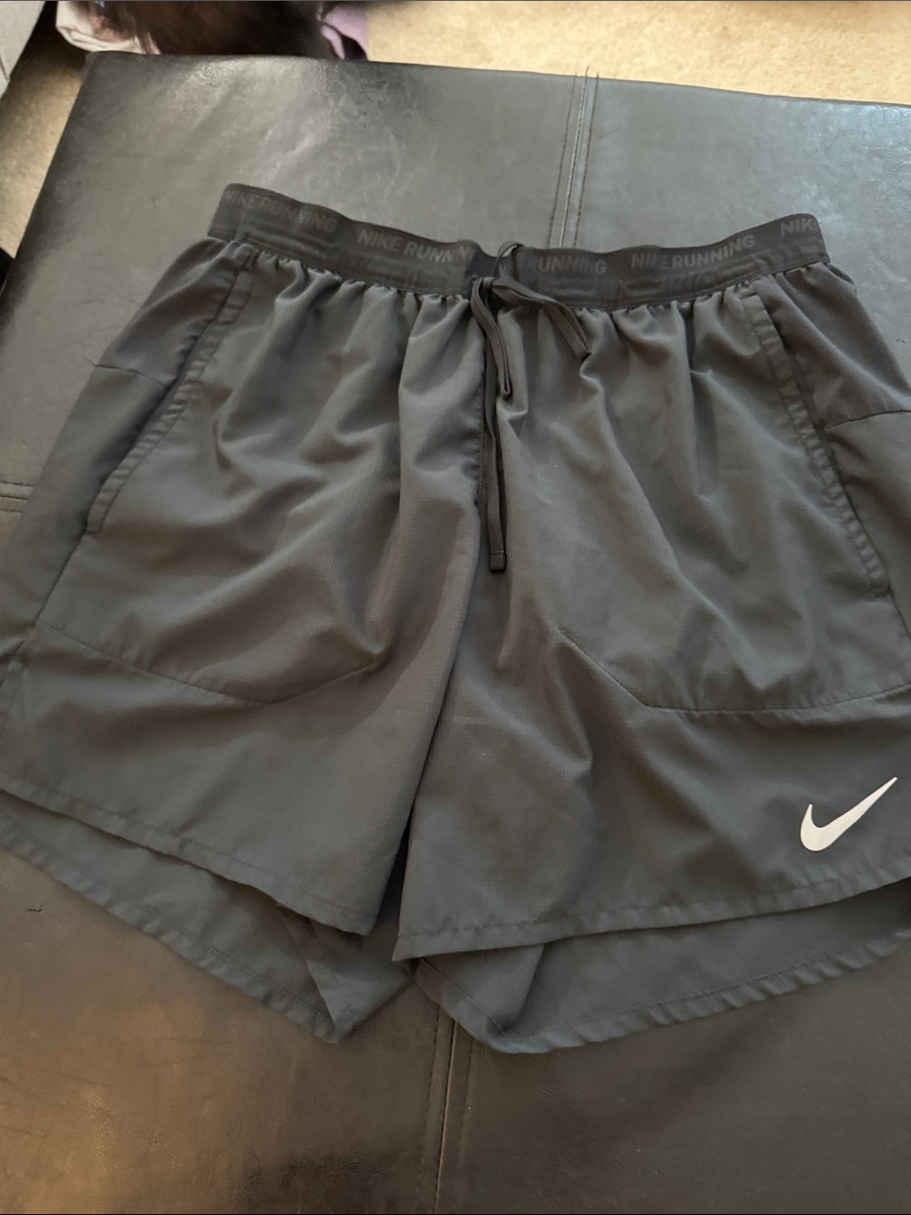 Nike Men's Dark Gray Athletic Running Shorts with White Swoosh